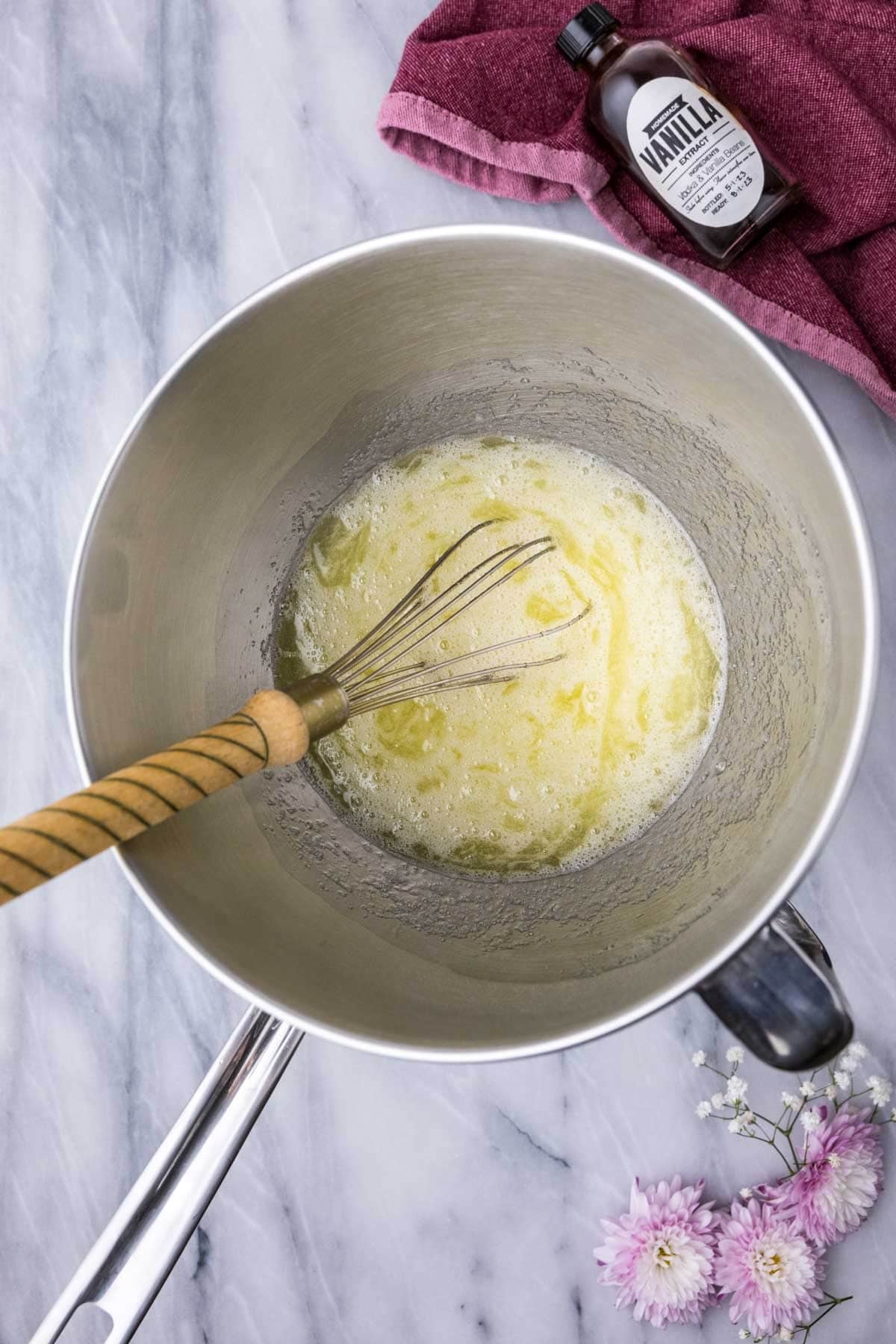 Overhead view of a meringue mixture in a double boiler.