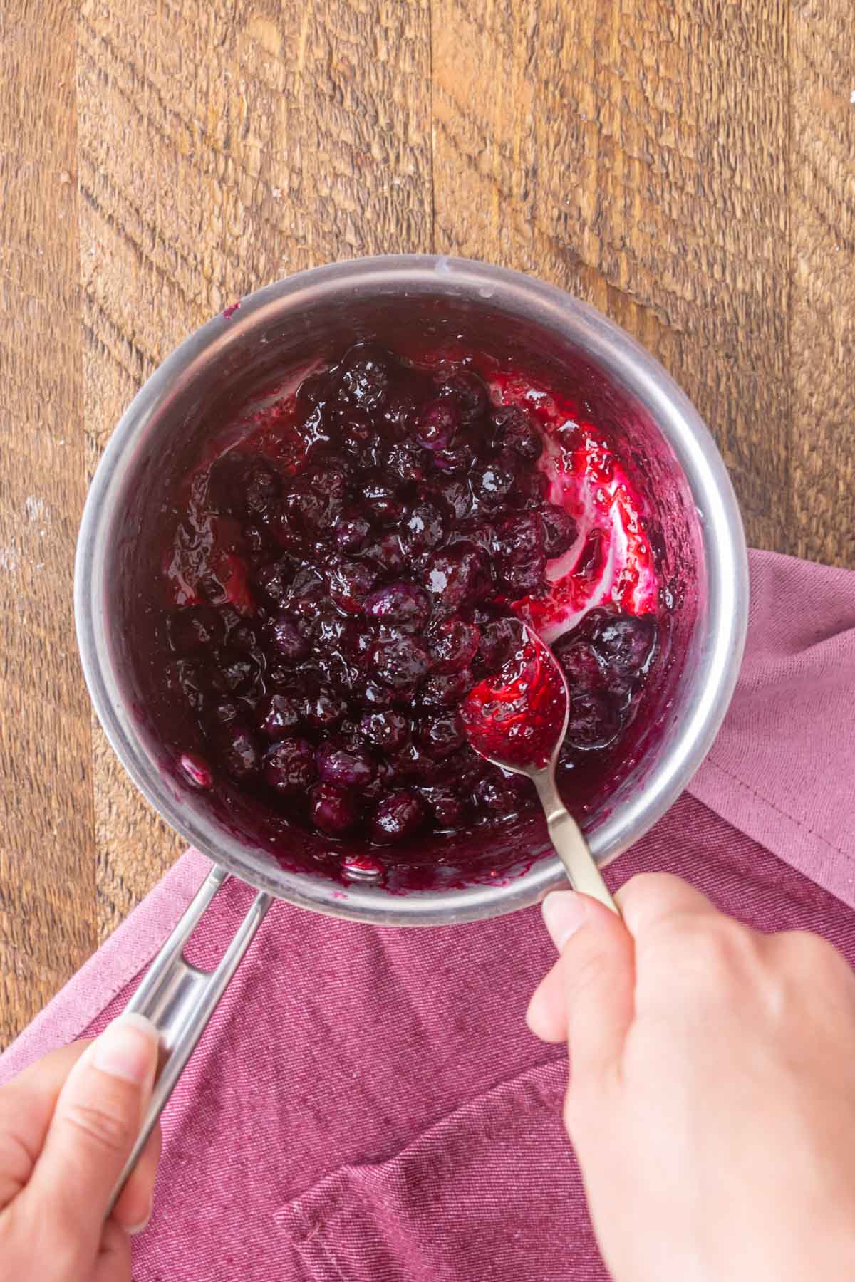 Overhead view of blueberry sauce in a pot.