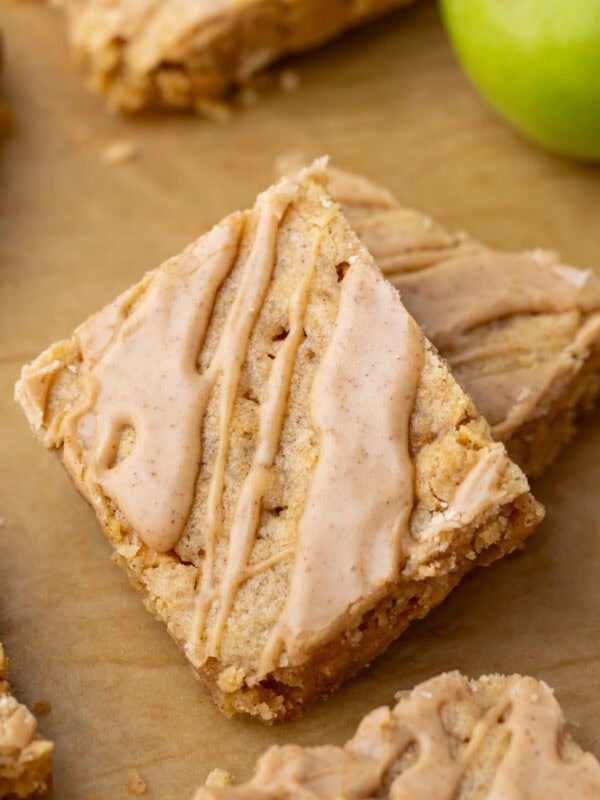 Close-up view of an apple blondies topped with a cinnamon maple glaze.