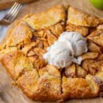 Golden brown and flaky apple galette topped with vanilla ice cream.
