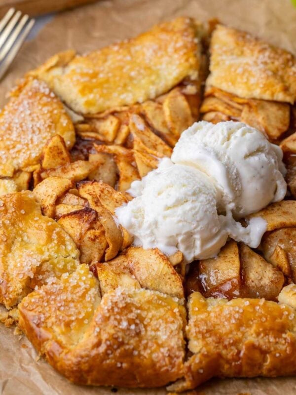 Golden brown and flaky apple galette topped with vanilla ice cream.