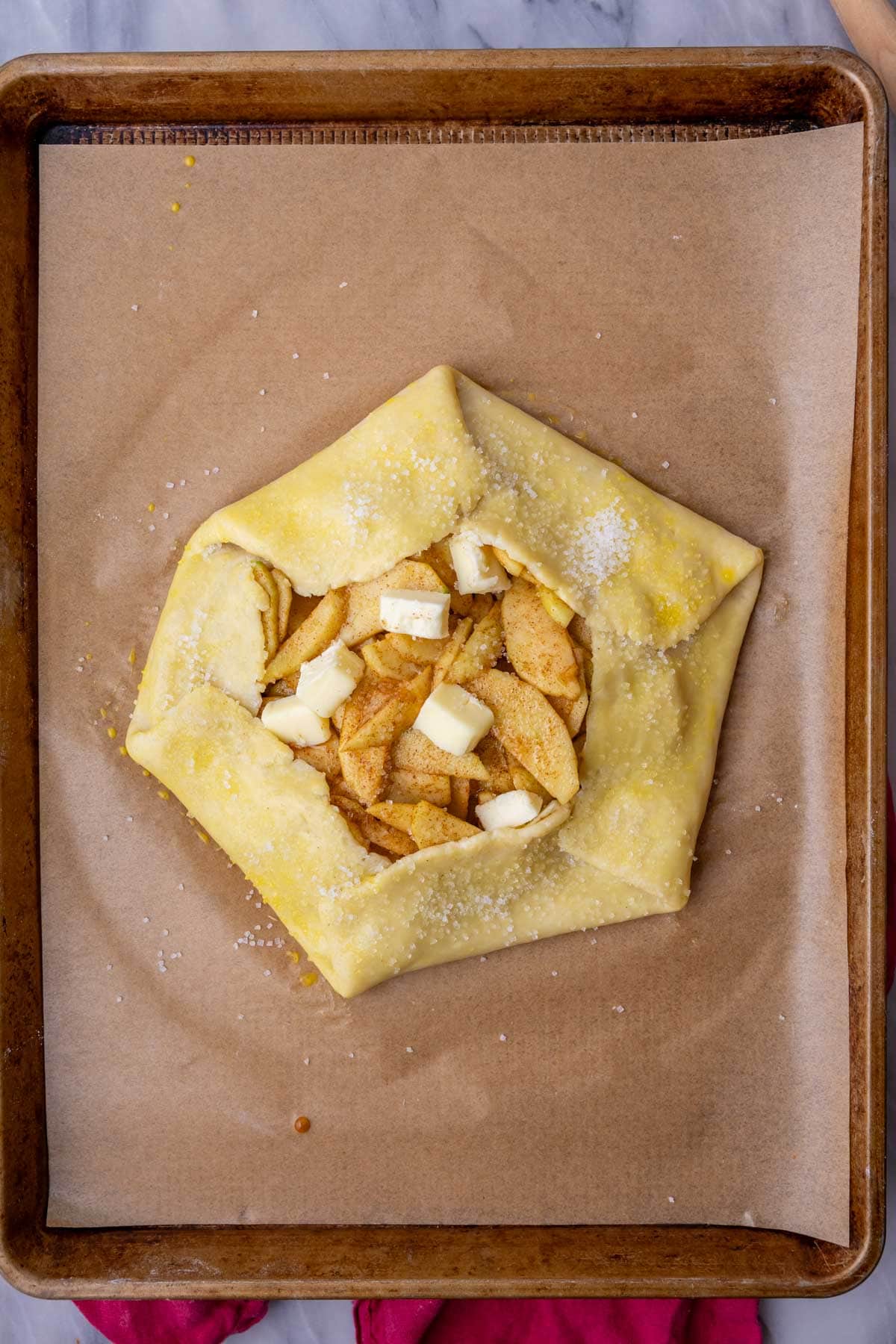 Overhead view of an apple galette before baking.