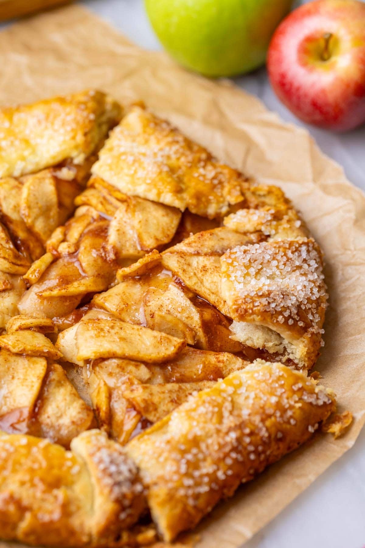 Close-up view of an apple galette topped with coarse sparkling sugar.