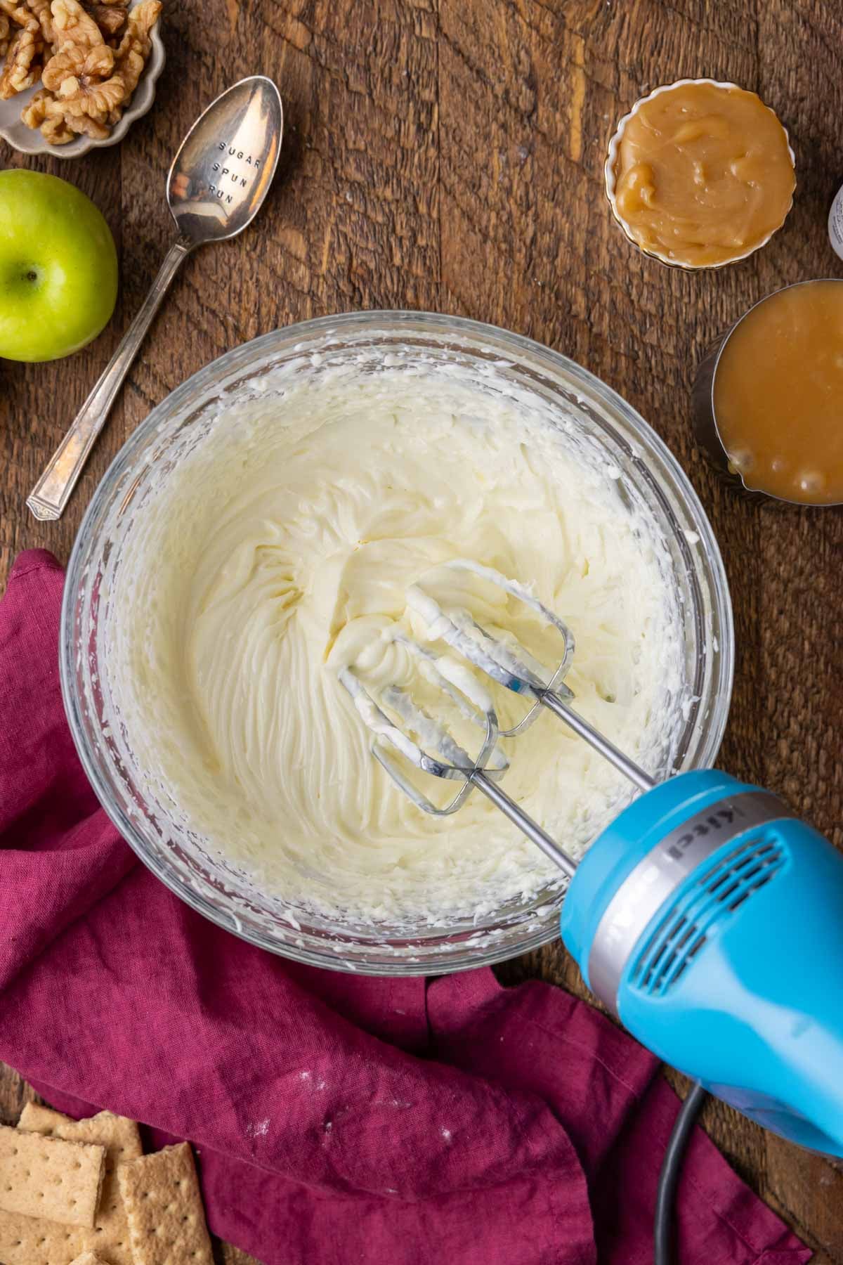 Overhead view of a whipped cream cheese mixture in a bowl.