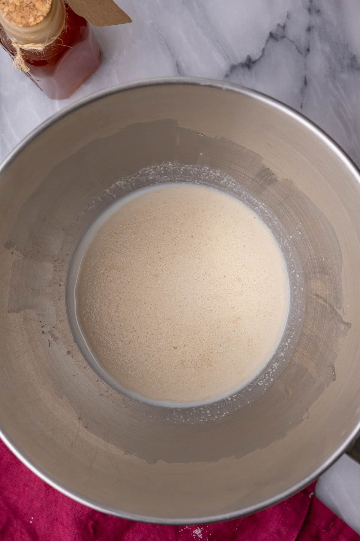 Overhead view of proofed yeast in a bowl.
