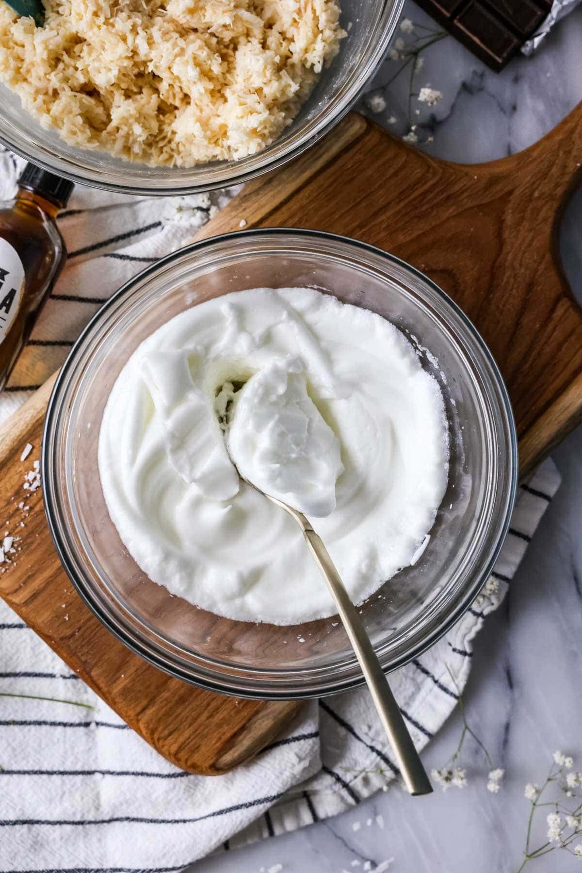 Bowl of egg whites that have been whipped to stiff peaks.