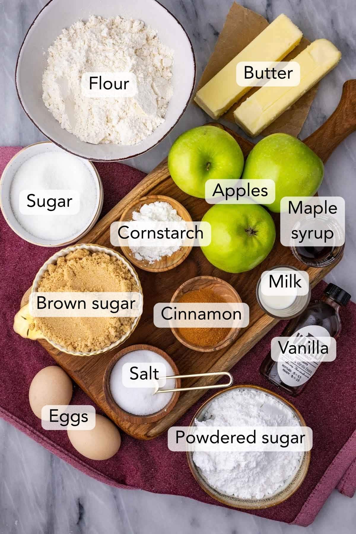 Overhead view of ingredients including apples, brown sugar, cinnamon, and more.