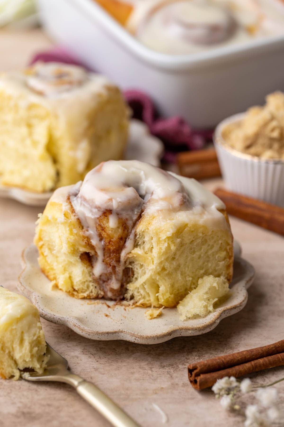 Close-up view of a pillowy, super soft and plush cinnamon roll made with tangzhong.