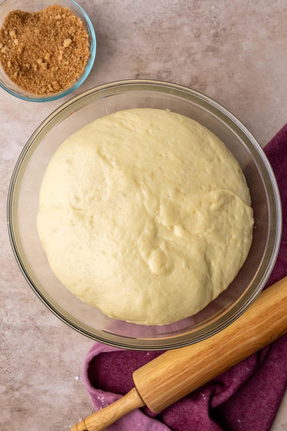 Overhead view of a bowl of risen dough.