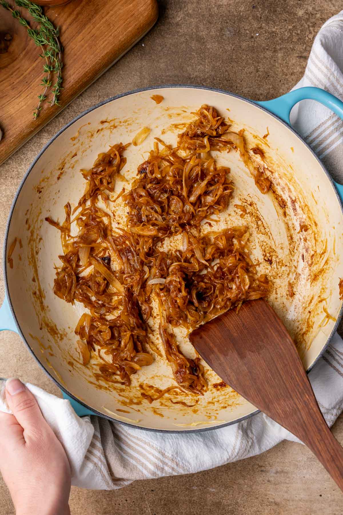 Overhead view of caramelized onions in a skillet.
