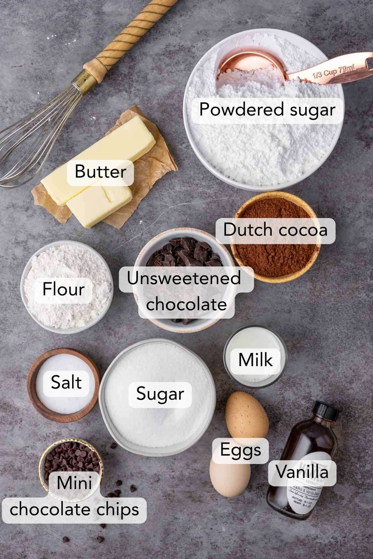 Overhead view of ingredients including cocoa powder, chocolate, butter, and more.