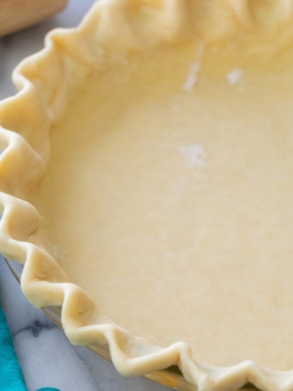 Close-up view of a fluted pie crust made from an easy pie crust recipe.