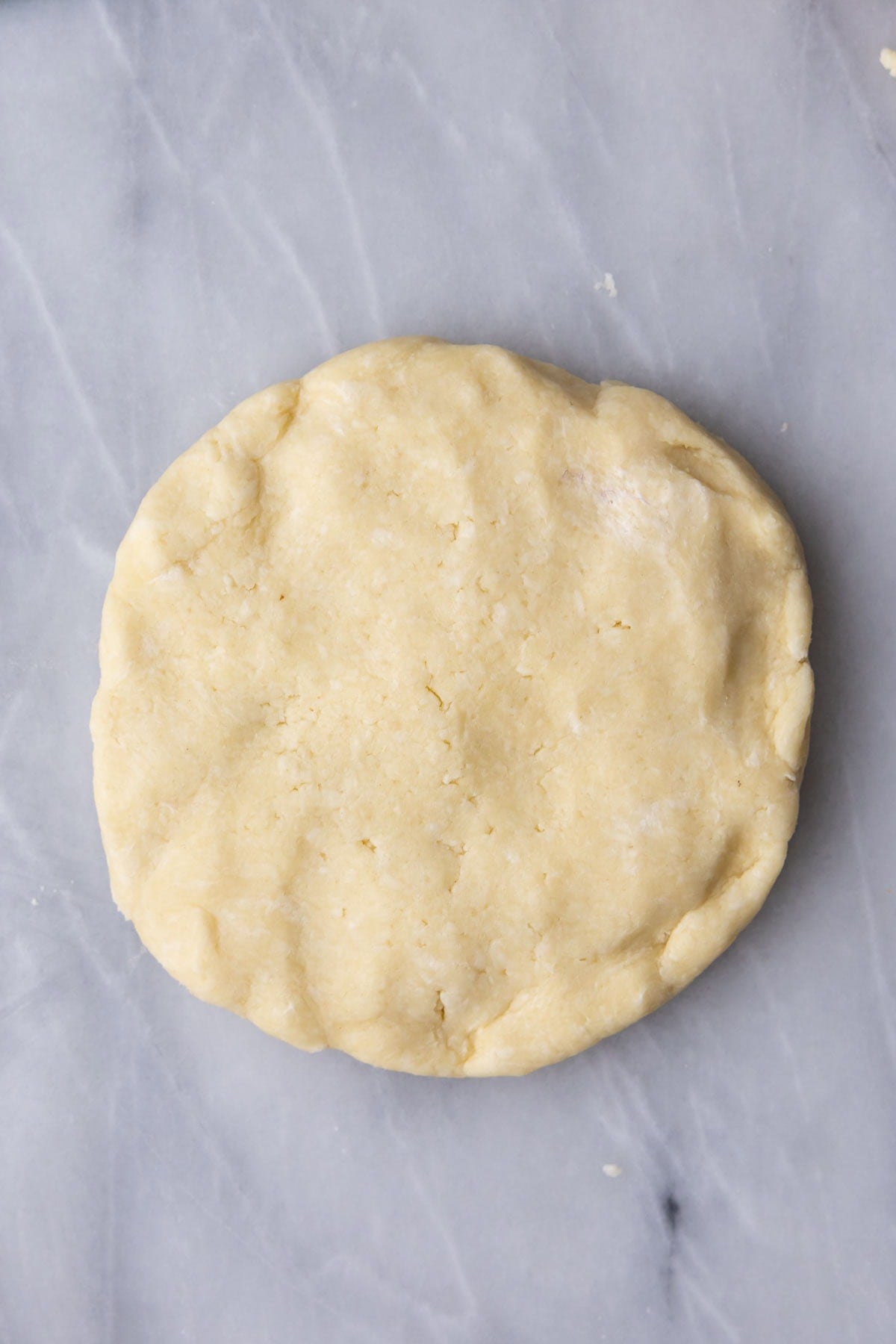 Overhead view of a disc of pie dough.